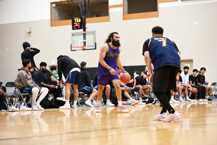 Coach Khush handling the ball in a game