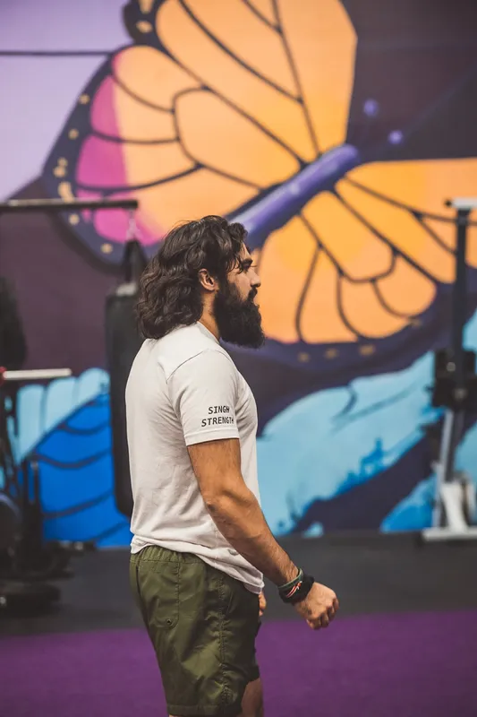 Coach Khush in a Singh Strength shirt