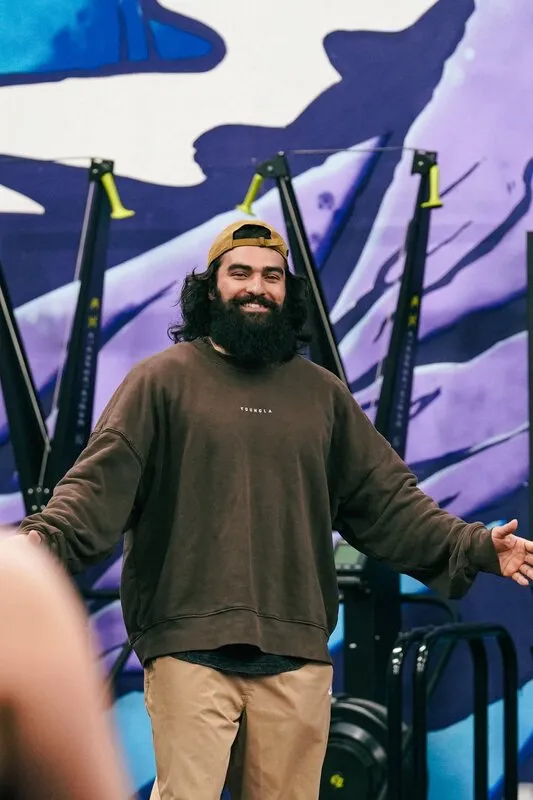 Coach Khush smiling in the gym